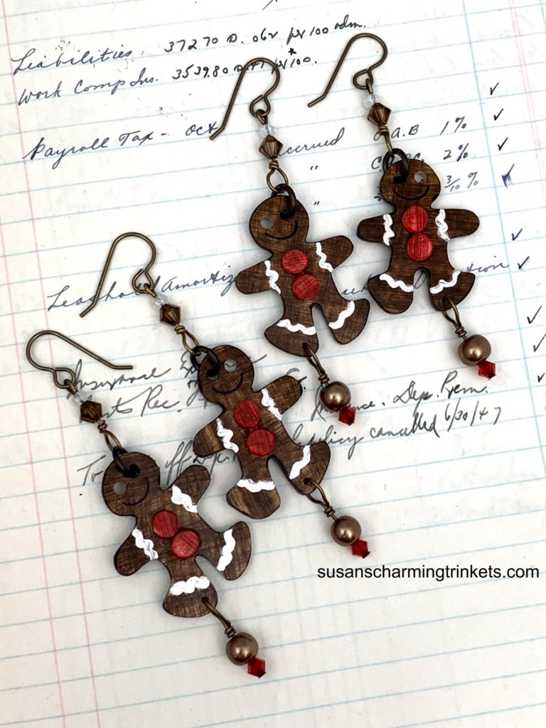 Two pair of ginger bread men earrings with red buttons
